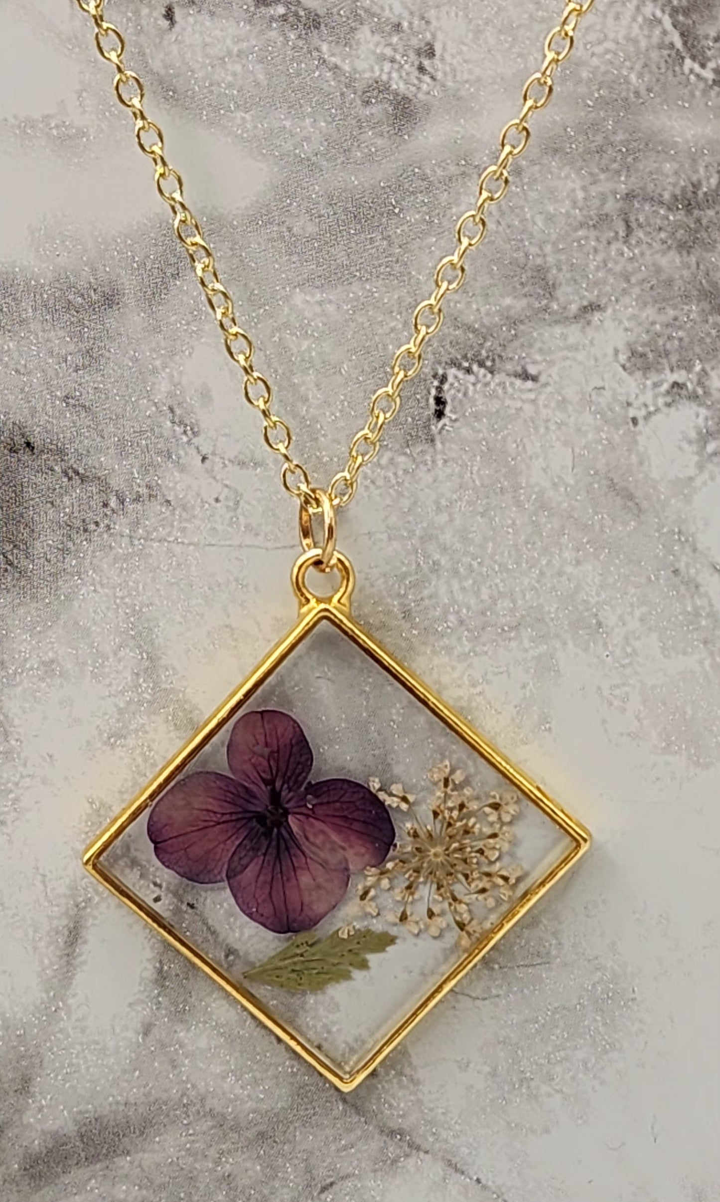 Dried Pressed Flower Resin Necklace in a Gold Plated Bezel
